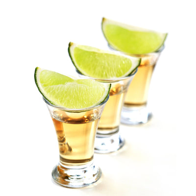 tequila shots with lime wedges
