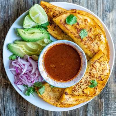 Crispy birria tacos dipped into consommé, beginner-friendly version made at home.